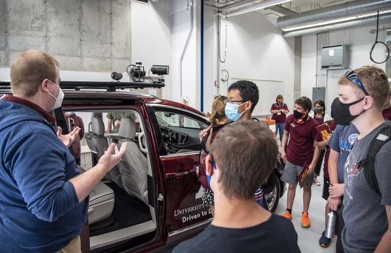 CAV camp students view autonomous vehicle